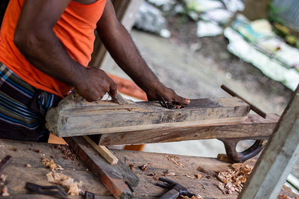 istock A carpenter is leveling wood with his wood leveling machine. 2222008279