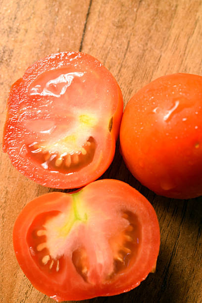istock Fresh Group Of Red Tomatoes On Wooden Table 2222009974