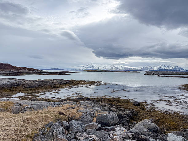 istock Coastal Cottages with Mountain View Overcast 2222012251