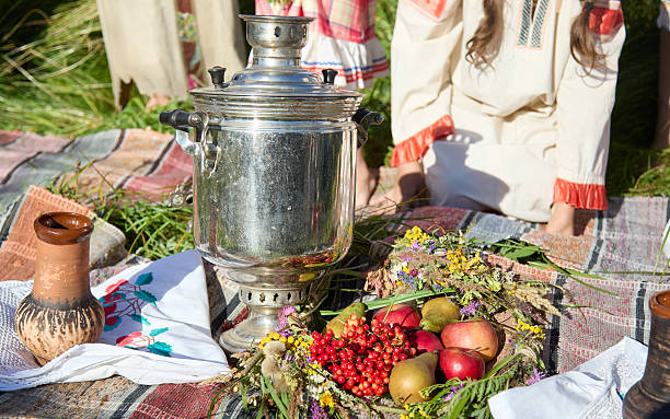 A tablecloth display of berries, fruits and drinks for a midsummer party