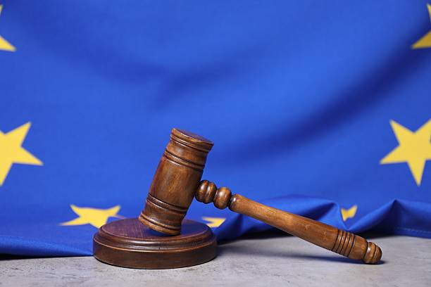istock Judge's gavel and European Union flag on grey table 2222015337
