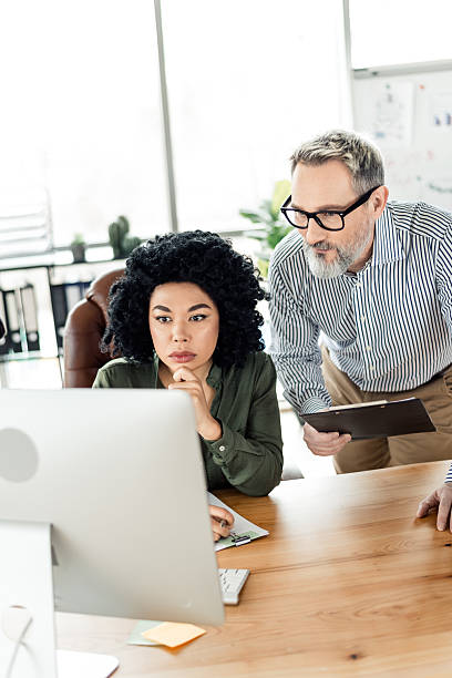 istock Young professionals collaborating in an office environment with focus on teamwork and innovation 2222016045