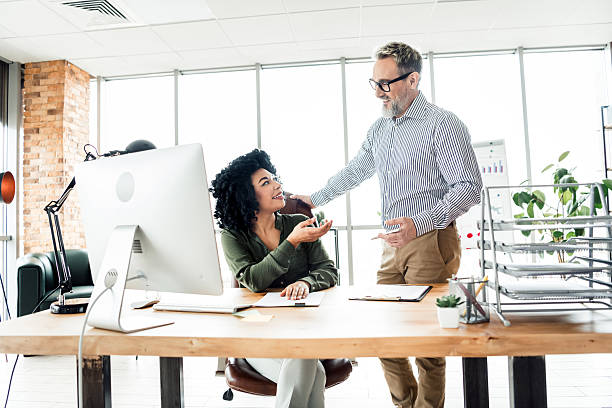 istock Professional colleagues collaborating in a modern office environment showcasing teamwork and effective communication 2222016073