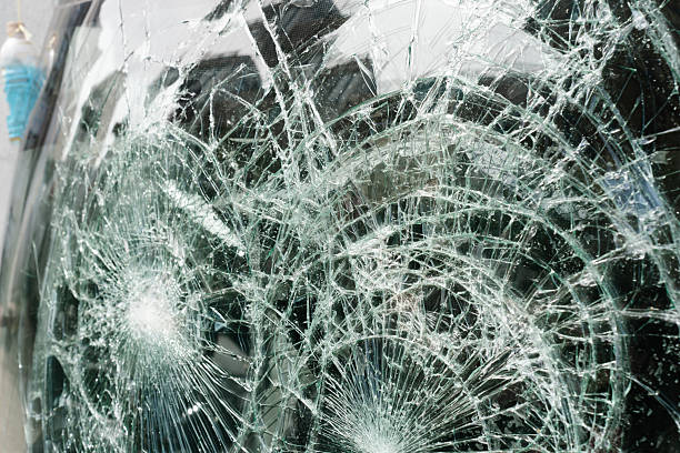 istock Broken glass with a spiderweb crack pattern, appearing to have been struck at the center. 2222016493