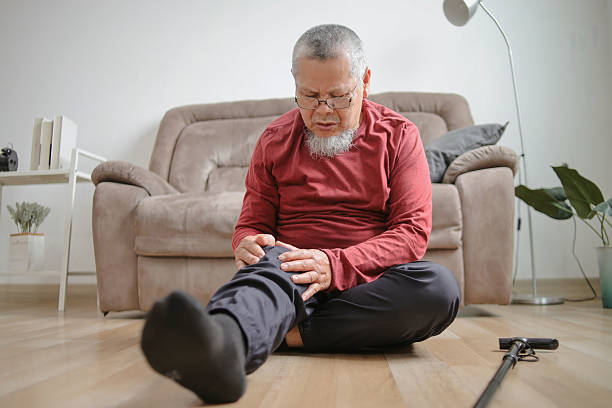 istock Senior Old Sick Man Suffering From Pain In Knee At Home 2222020295