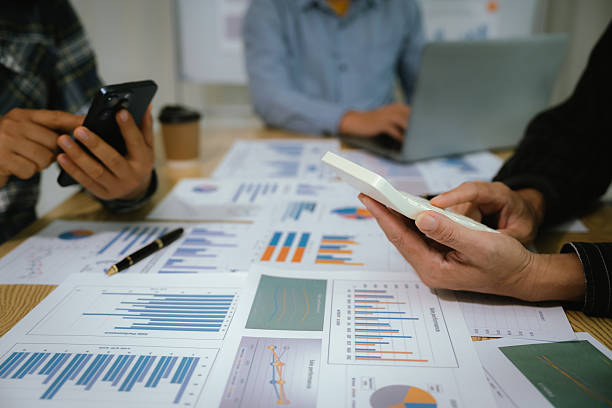 istock A professional business team collaborates around a conference table, analyzing charts, discussing strategies, reviewing reports, and planning innovative solutions to drive growth, efficiency, and long 2222023975