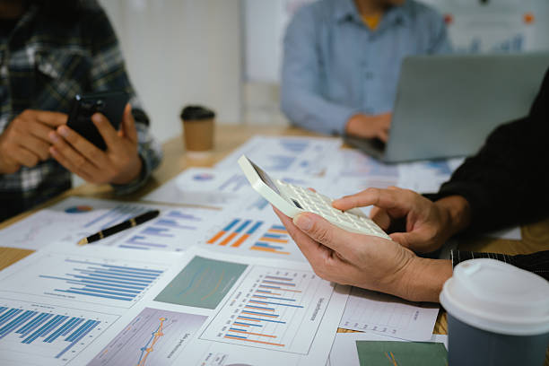 istock A professional business team collaborates around a conference table, analyzing charts, discussing strategies, reviewing reports, and planning innovative solutions to drive growth, efficiency, and long 2222023978