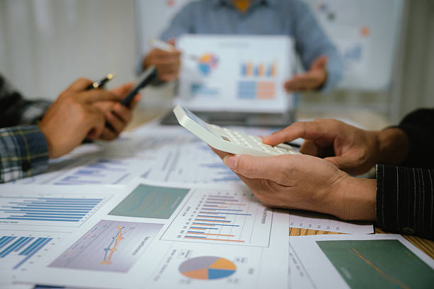 istock A professional business team collaborates around a conference table, analyzing charts, discussing strategies, reviewing reports, and planning innovative solutions to drive growth, efficiency, and long 2222023992