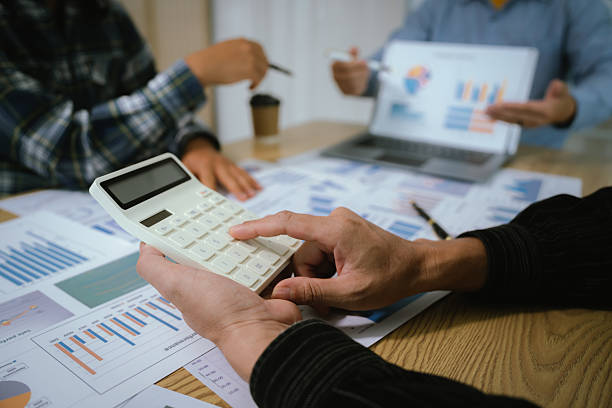 istock A professional business team collaborates around a conference table, analyzing charts, discussing strategies, reviewing reports, and planning innovative solutions to drive growth, efficiency, and long 2222024004