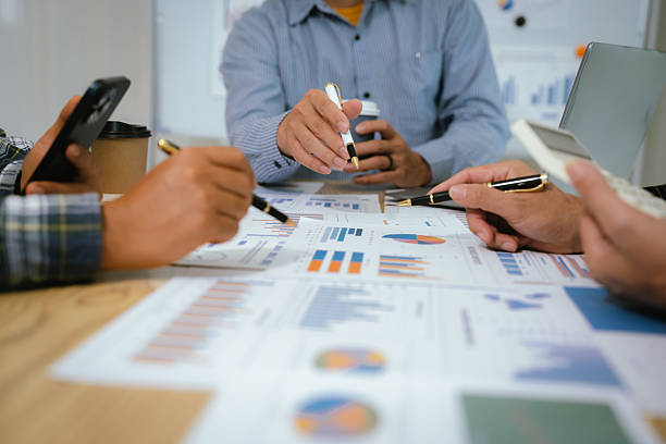 istock A professional business team collaborates around a conference table, analyzing charts, discussing strategies, reviewing reports, and planning innovative solutions to drive growth, efficiency, and long 2222024052