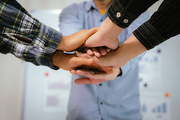 istock A professional business team collaborates around a conference table, analyzing charts, discussing strategies, reviewing reports, and planning innovative solutions to drive growth, efficiency, and long 2222024099