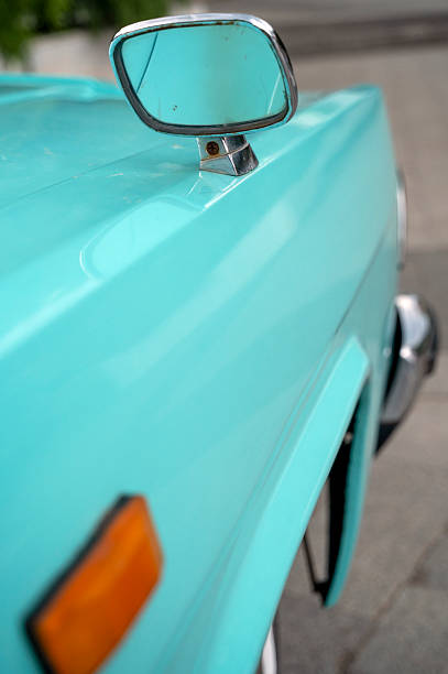 Windsor, Ontario, Canada - August 12, 2022:  Classic cars driving around downtown Windsor during  a classic car cruise community event.  This is a closeup of a classic vintage Cadillac.