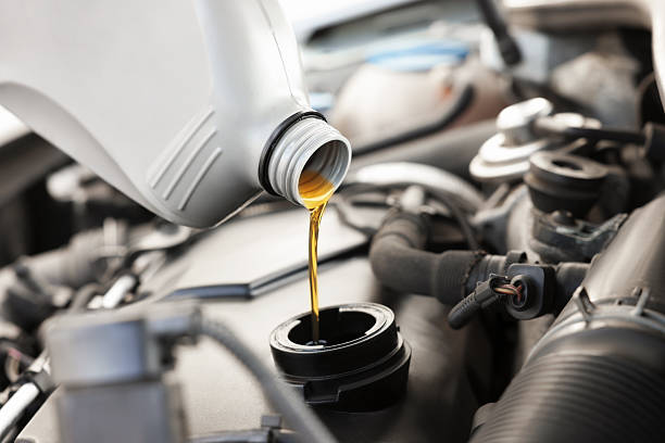 istock Pouring motor oil into car engine, closeup 2222024720