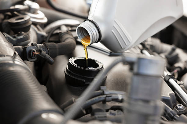 istock Pouring motor oil into car engine, closeup 2222024722