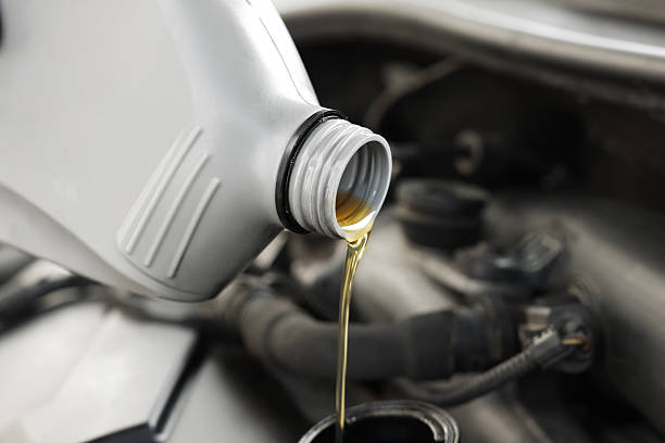 istock Pouring motor oil into car engine, closeup 2222024723