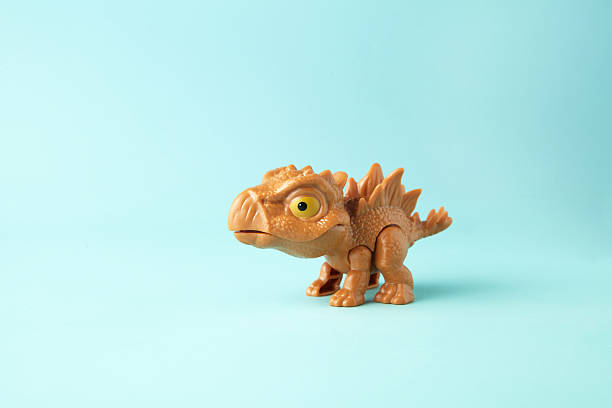 istock Small and cute plastic stegosaurus toy 2222028557