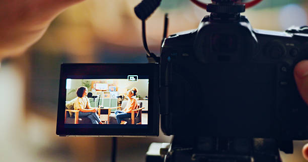 istock Hands, camera and recording people for podcast talk show, live streaming and hosting broadcast. Screen, presenter and video interview for content creator, radio news and information update in studio 2222031685