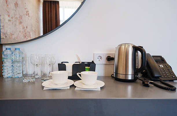 istock two empty white tea or coffee cups on a table in the hotel room. 2222032377