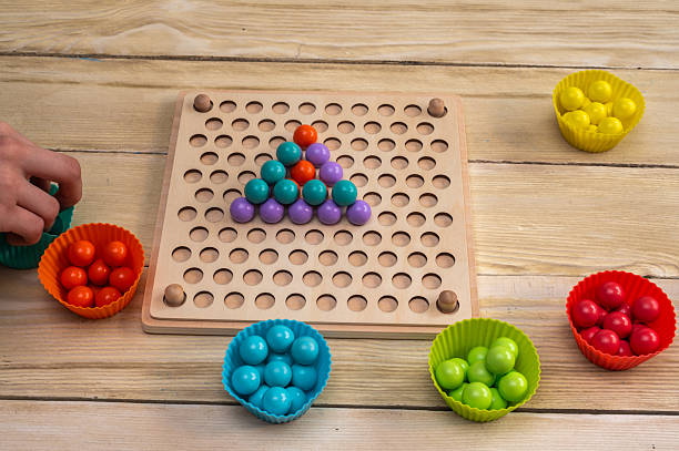 istock a children's game that develops fine motor skills and logical thinking in children according to the Montessori system. 2222035565