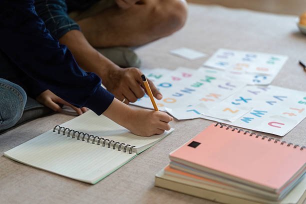 istock Father and Son Learning Together. Engaging in educational activities at home. 2222039248