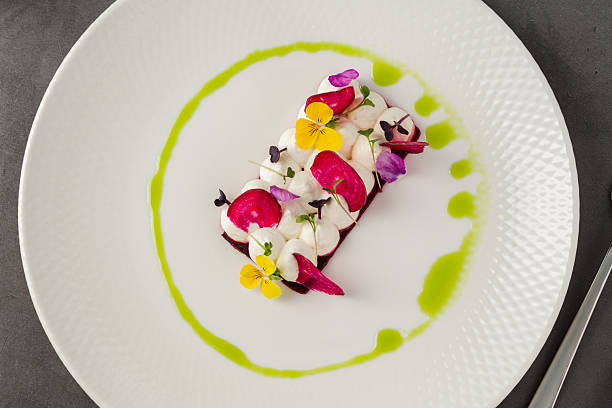 istock Colorful beetroot slices with goat cheese, garnished with edible flowers 2222039281