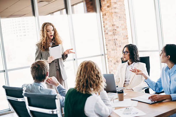 istock Young professionals having a productive business meeting in a modern office, discussing projects and strategies. 2222039679