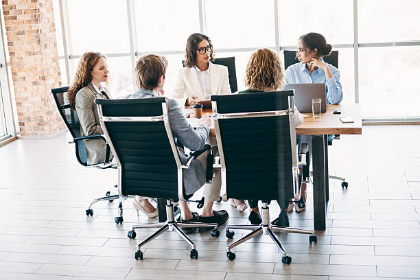 istock Professional team members collaborating during a business meeting in a modern office space, discussing strategies and projects for success. 2222039720