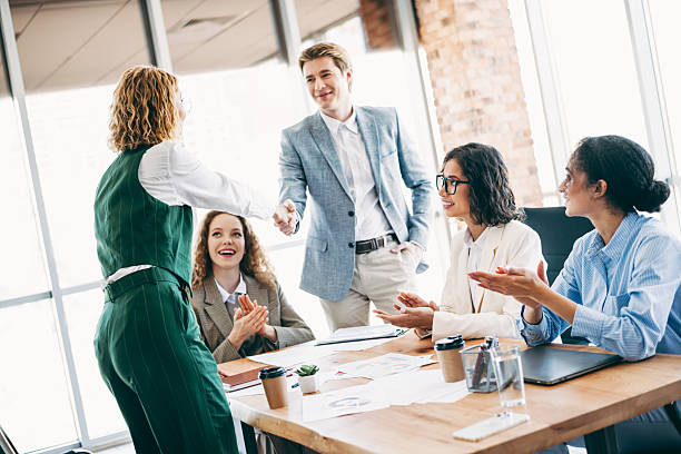 istock Dynamic team collaborating in a modern office environment showcasing professionalism and successful teamwork 2222039745