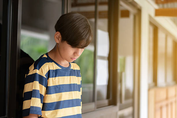 istock Asian boy in sad mood 2222039819