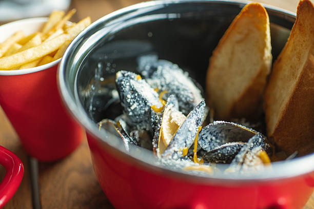 Mussels in cheese sauce in a restaurant