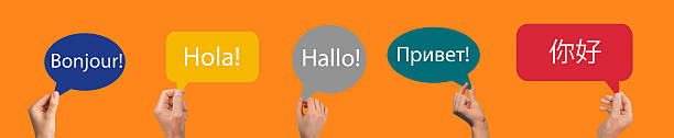 Speech bubbles with hello, greeting word in diverse foreign languages. French, Spanish, German, Russian and Chinese speaking
