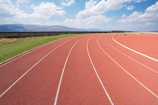 istock Empty athlete track or running track with blue sky. 2222043240