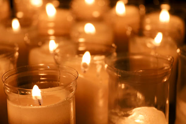 istock Group of candles in a church 2222045255