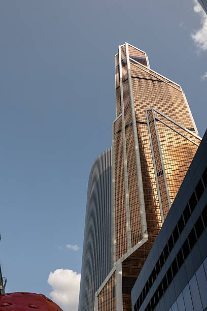 istock Sleek Modern Architecture of a Skyscraper in Moscow Displaying Unique Design and Shimmering Facade Under a Clear Blue Sky 2222045641