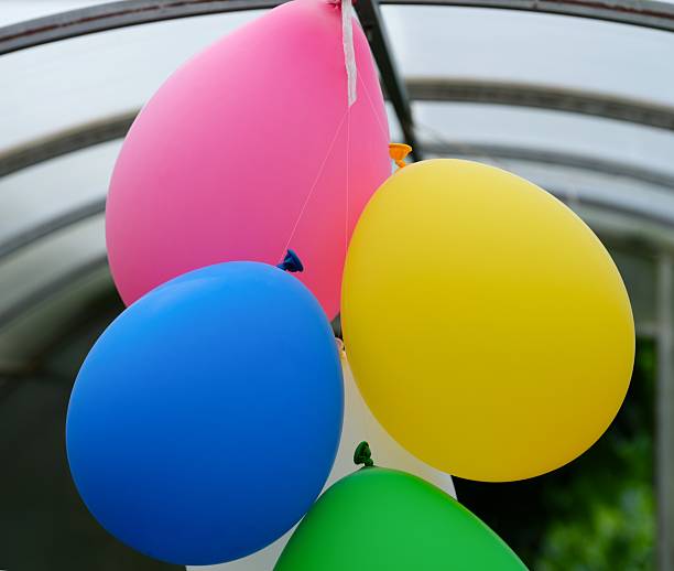 istock A bunch of hanging multicolored balloons 2222047795