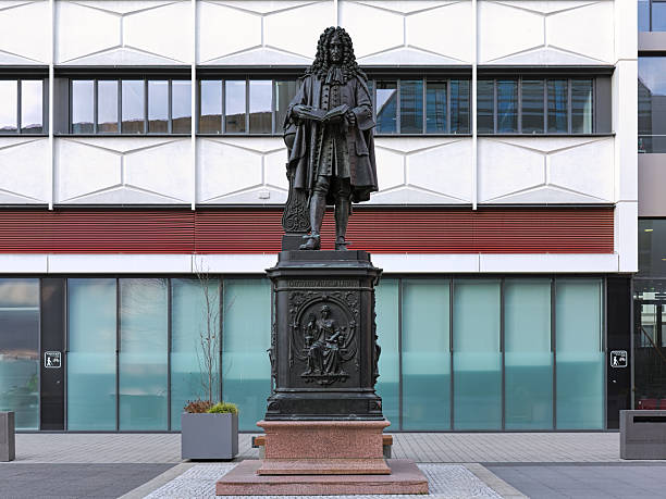 Leipzig, Germany - December 17, 2018: Leibniz Monument at the courtyard of the new campus of University of Leipzig (Leibniz Forum). The monument by the German sculptor Ernst Julius Hahnel (1811-1891) was unveiled on October 25, 1883 in front of St. Thomas Church. Since 2008, it stand at the present location.