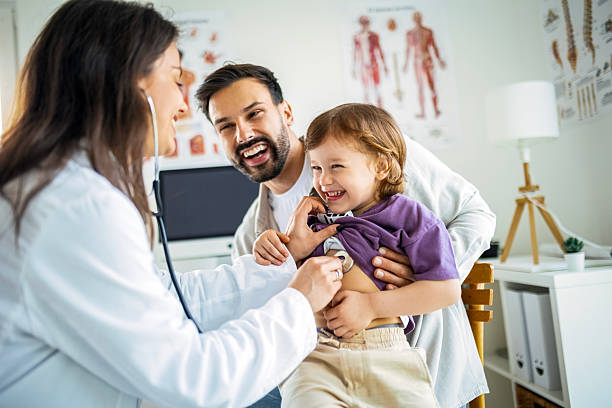 istock Pediatric Health Checkup with Stethoscope and Supportive Father 2222050399