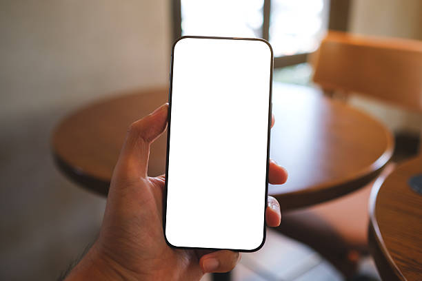 istock Mockup image of a man holding mobile phone with blank white screen in cafe 2222051263