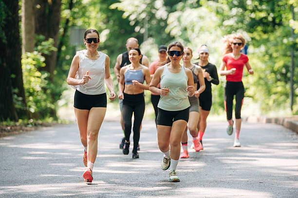 Marathon conception, front view. Group of runners are together outdoors