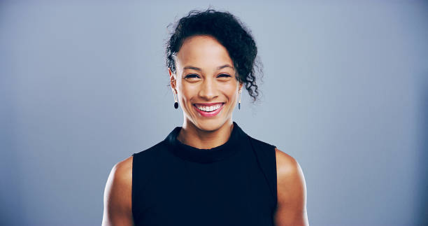 istock Portrait, creative and business woman in studio, screenwriter and script author isolated on gray background space. Face, entrepreneur and happy person, confident professional and worker 2222063655