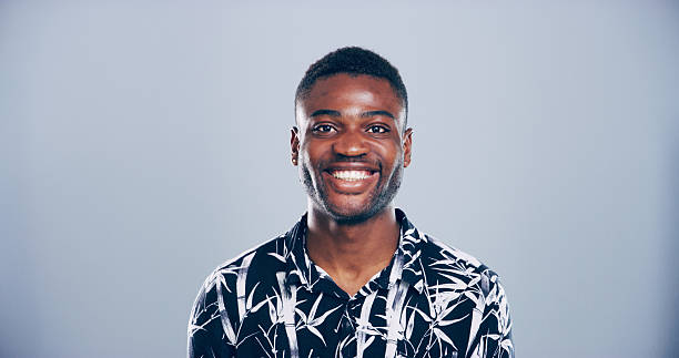 istock Black man, smile and studio portrait with creative employee, pride and confident for freelance career on blue background. Writer, freelancer or author person with professional face by mockup space. 2222063664