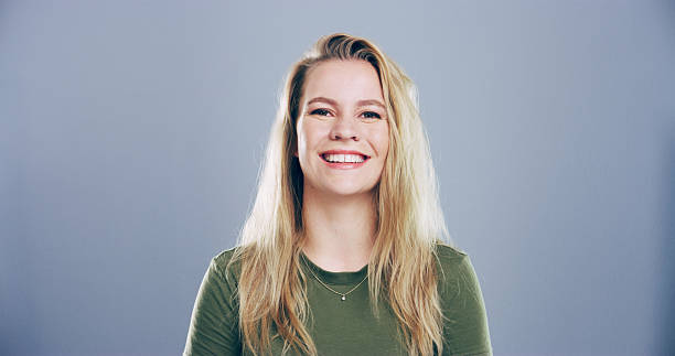 istock Portrait, space and student with happy woman in studio for development, education or learning. College, smile and university with female person on gray background mockup for school scholarship 2222063674