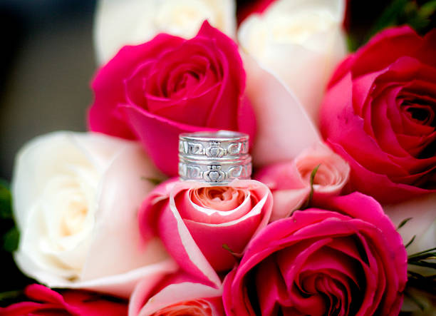 istock Wedding Rings on A Bouquet 2222064694