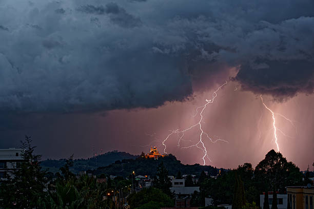 lightnings near the temple santuario de la virgen de los remedios. - kuvvetli yağmur stok fotoğraflar ve resimler