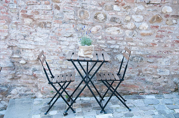 istock beautiful iron table for two in an ancient road 2222071497