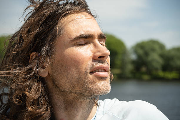 istock Thoughtful handsome brunette man with long hair 2222071984