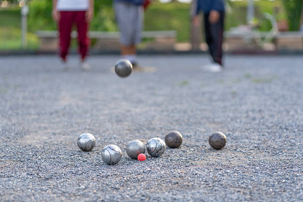 istock petanque practice on playing field,group of people throwing boules,selective focus at bocce balls,athlete,sport,competition 2222073233