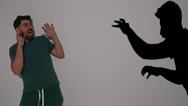 Surprised Man Reacts to Spooky Silhouette Shadow Behind