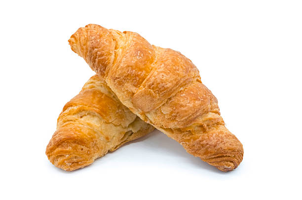 istock Two large Croissants on white table background 2222075386