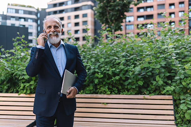 istock Happy Businessman Talking on Phone Outdoors Today 2222076950